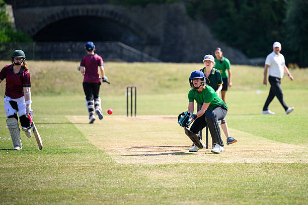 istock Wicketkeeper ready to catch ball as batting team score a run 2226458585