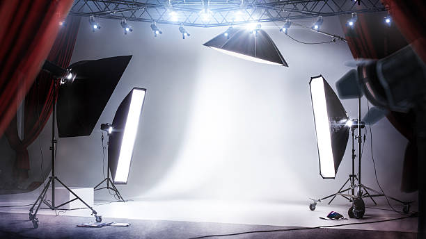 istock Red theater curtain and professional lighting. Studio background with white backdrop and backlight. Mockup 2226458599
