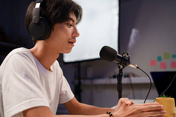 istock Female podcaster interviewing a guest in a recording studio 2226459989