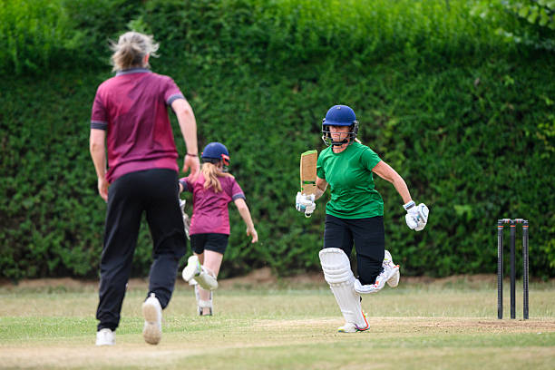 istock Mature female batsman running between wickets scoring while wicketkeeper chases down the ball 2226460038