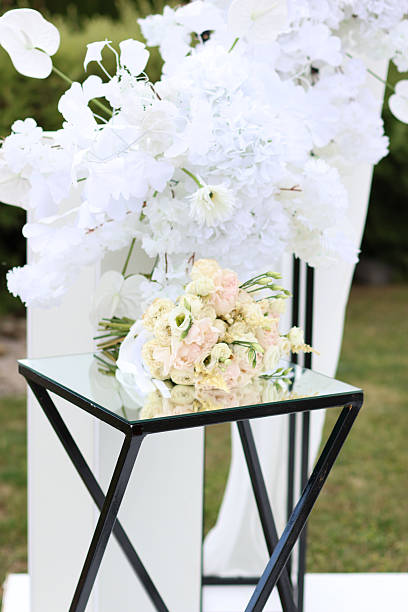 istock Beautiful white wedding bouquet on a mirrored table. Wedding ceremony. 2226461266