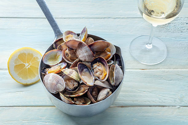 istock Vongole clams in a sauce pan, with lemon and white wine 2226464493