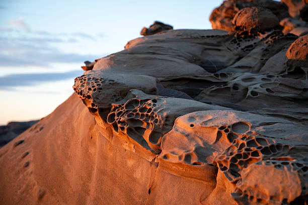 istock Rock with holes at sunset 2226464998