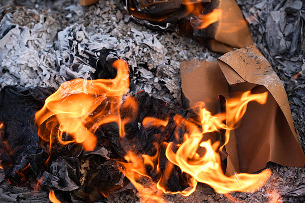 Burning  Paper Packaging in Flames and Ashes.
