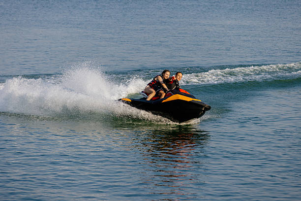 istock Happy couple riding a jet ski. 2226469487