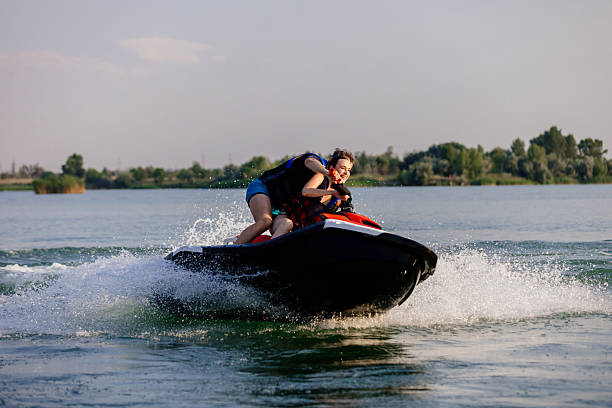 istock Happy couple riding a jet ski. 2226469536