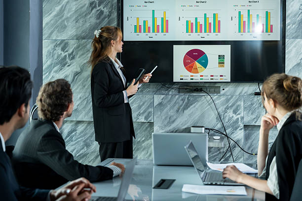 istock Multiracial business professionals watching data presentation on screen during company meeting in office conference room discussing performance analysis and future planning together 2226469918