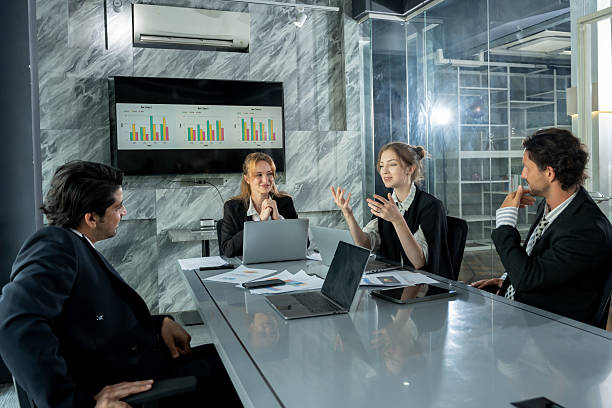 istock multiracial group of business people discussing report data during meeting inside modern office with technology device teamwork presentation for office work and business collaboration concept 2226470028