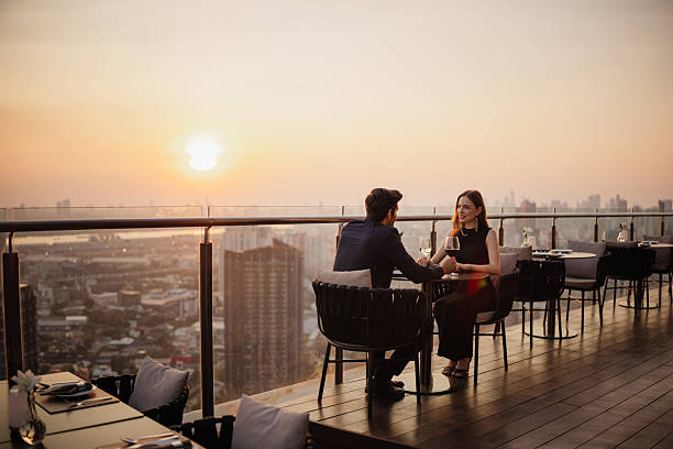 istock Couple enjoying romantic rooftop dinner 2226472053