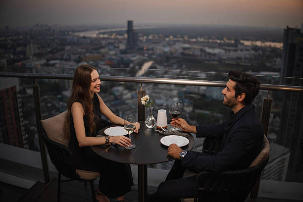 istock Couple enjoying romantic rooftop dinner 2226472133