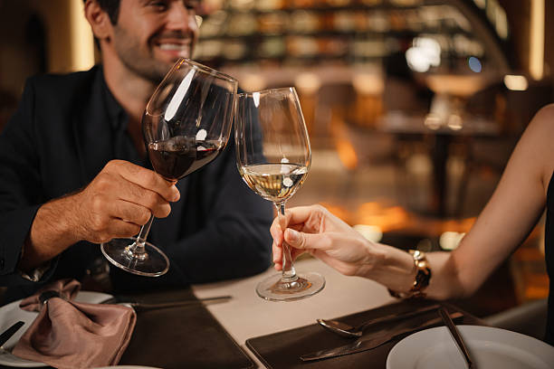 istock Couple toasting with wine glasses 2226472336