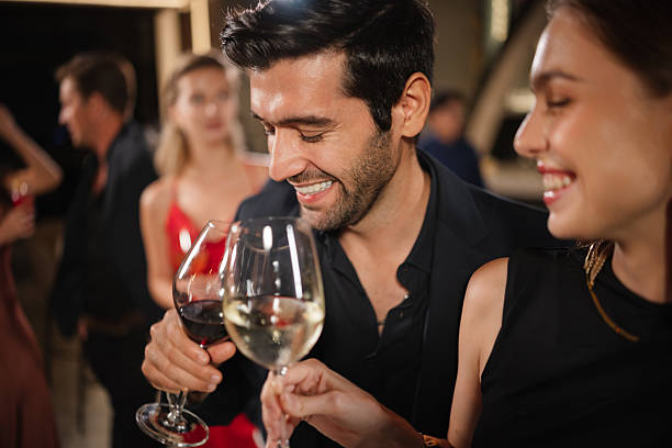 istock Elegant couple enjoying at a party 2226472462