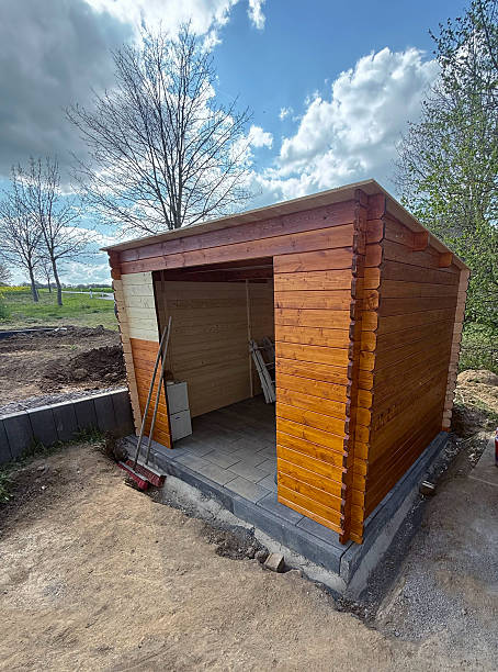 istock Hovel after work in evening, golden hour. Garden shed front view with hoe, string trimmer, rake and grass-cutter. 2226473033