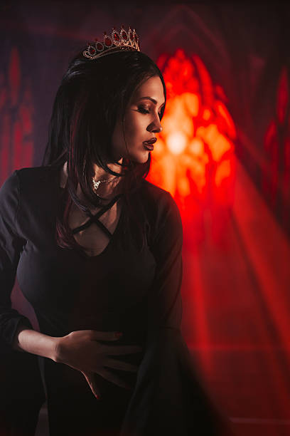 istock Female Vampire In A Castle Under Red Lights 2226473562