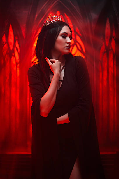 istock Female Vampire In A Castle Under Red Lights 2226473778