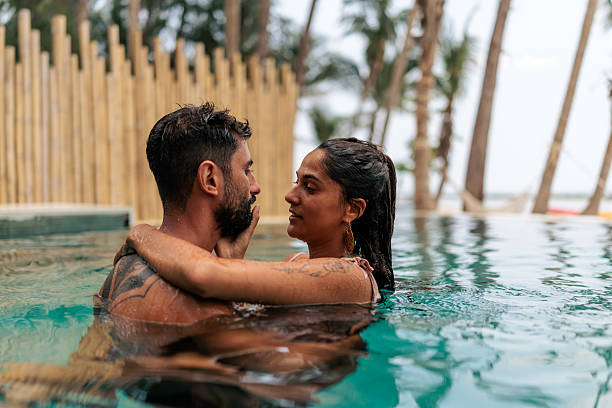 istock Romantic couple embracing in pool 2226476261