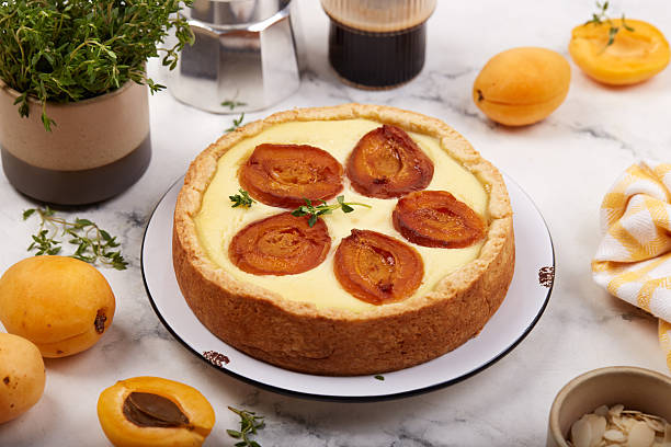 istock Cheesecake pie tart with apricots and thyme. 2226476370