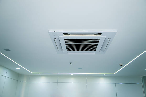 istock Ceiling-mounted air conditioner with integrated light and speaker, showcasing modern HVAC design.. 2226476934