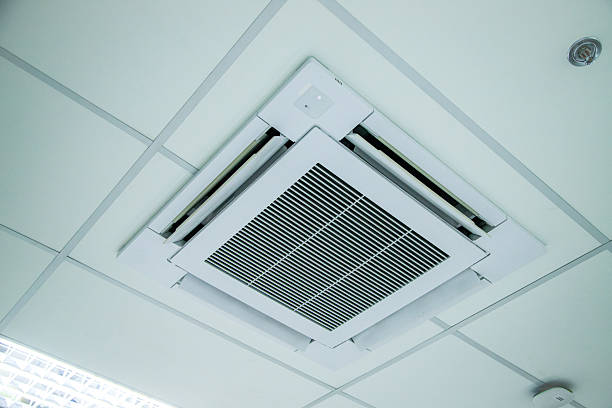 istock Ceiling-mounted air conditioner with integrated light and speaker, showcasing modern HVAC design.. 2226476946