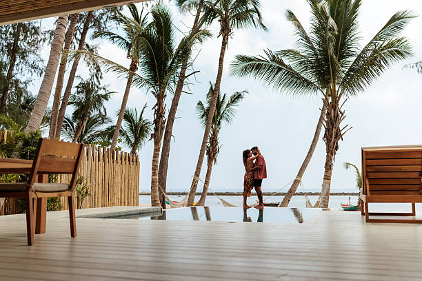 istock Couple kissing in tropical paradise 2226477968