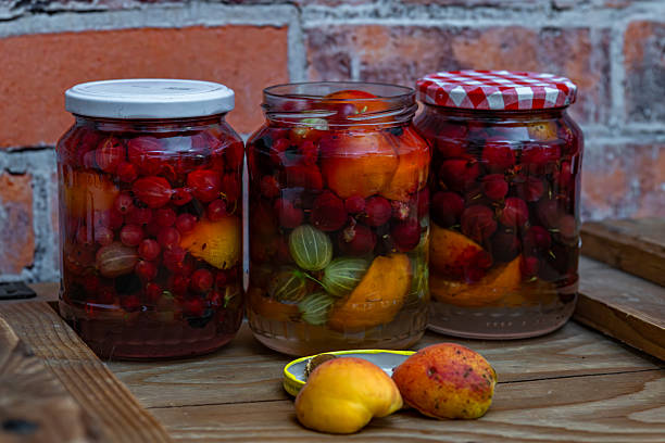 istock Fruit mix compote on wooden box near brick old wall 2226488837
