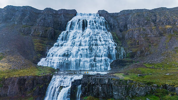 istock Majestic waterfall cascading down cliffs in Iceland landscape during overcast weather 2226492326