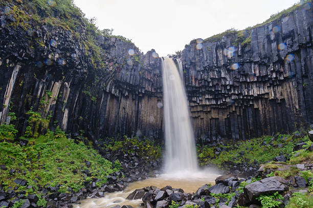 istock Majestic waterfall cascading down unique basalt columns in Icelands stunning landscape 2226493158