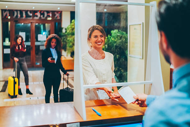 istock Hotel guest taking access card from receptionist 2226500067