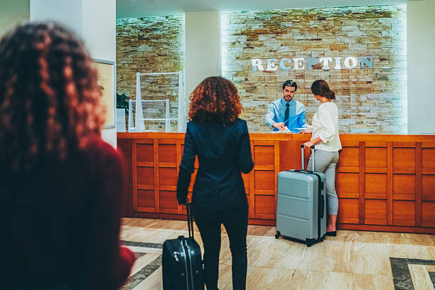 istock Hotel guest taking access card from receptionist 2226500798