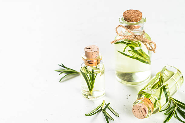 istock Rosemary essential oil in the bottle on white. 2226500971