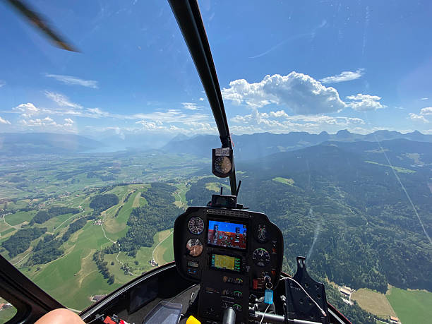 istock Alpine helicopter flies over mountains 2226501255