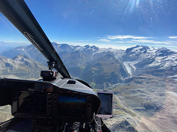 istock Alpine helicopter flies over mountains 2226501256