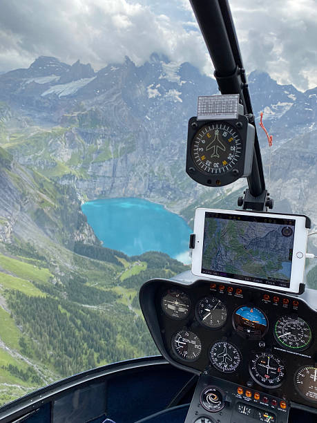 istock Alpine helicopter flies over mountains 2226501259