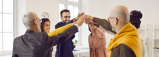 istock Business people who are inspired by fruitful cooperation join hands in unity and teamwork. 2226501486