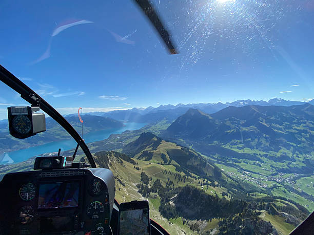 istock Alpine helicopter flies over mountains 2226501785