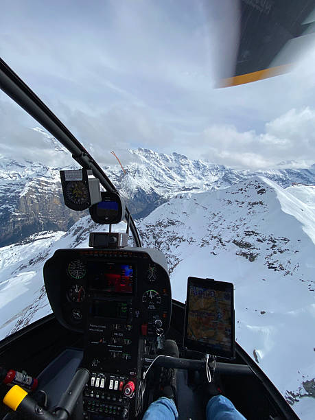 istock Alpine helicopter flies over mountains 2226501786