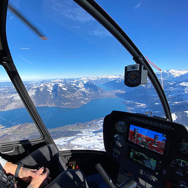istock Alpine helicopter flies over mountains 2226501892