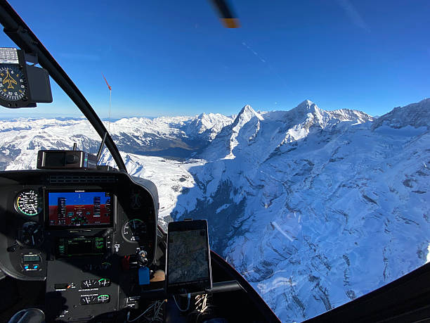 istock Alpine helicopter flies over mountains 2226502032
