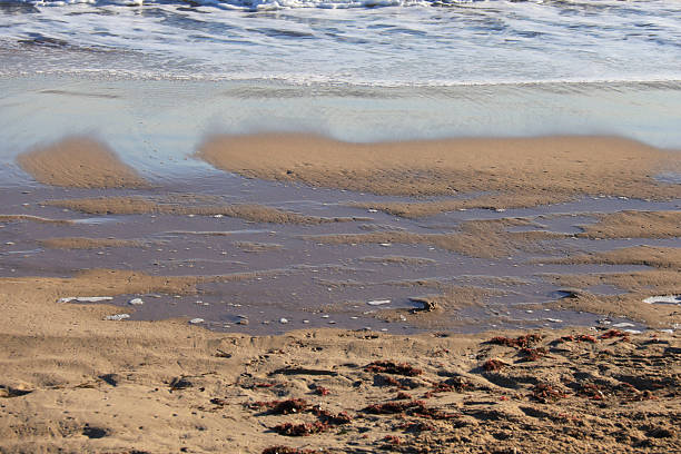 istock Waves on the shore on the beach 2226502244