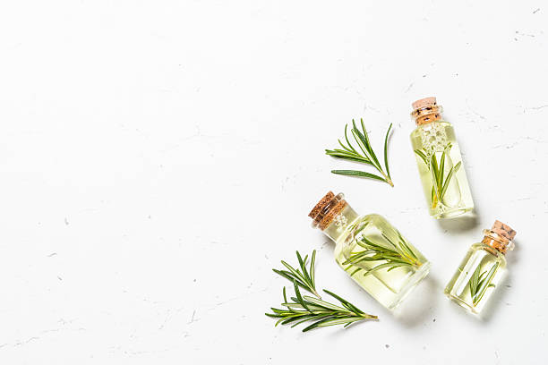 istock Rosemary essential oil in the bottle on white. 2226502453