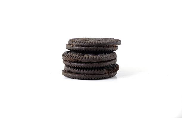 istock Stacked Chocolate Sandwich Cookies on White Background 2226502566