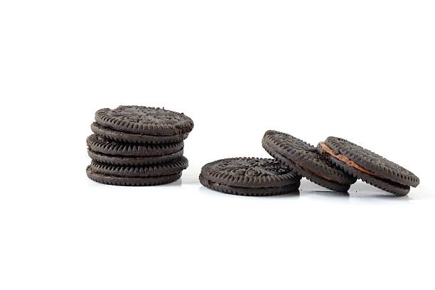 istock Stacked Chocolate Sandwich Cookies on White Background 2226502616