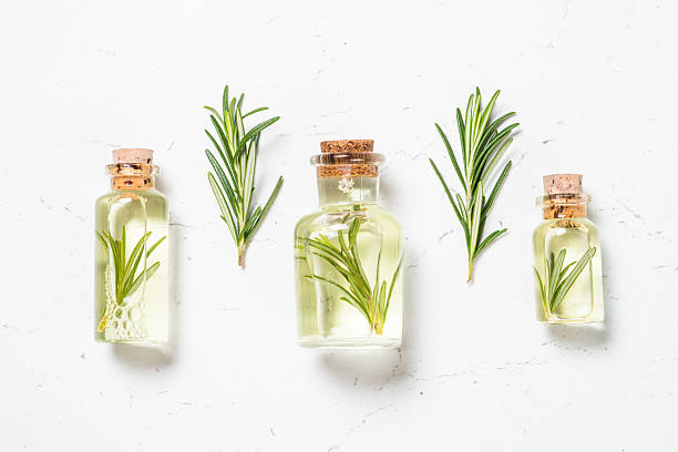 istock Rosemary essential oil in the bottle on white. 2226502643