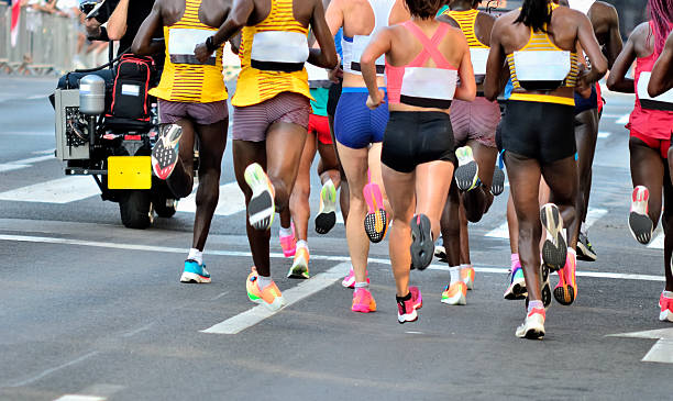 Marathon running race, support runners on road, child's hand giving highfive, sport concept