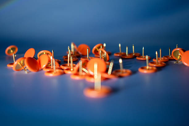 Colorful thumbtacks close up for background