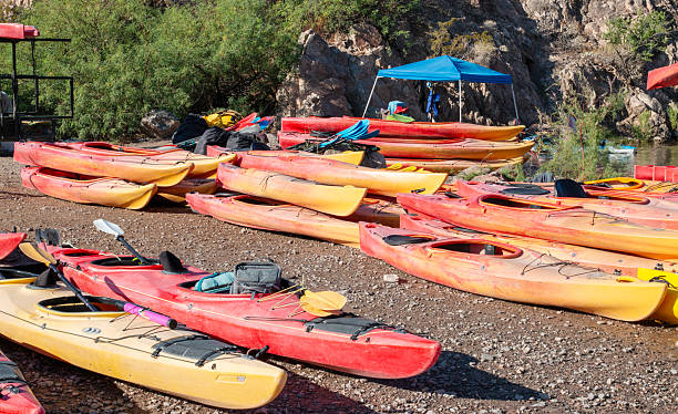 istock Colorful Kayaks on a Shoreline Ready for Exploration at a Sunny Lake 2226507135