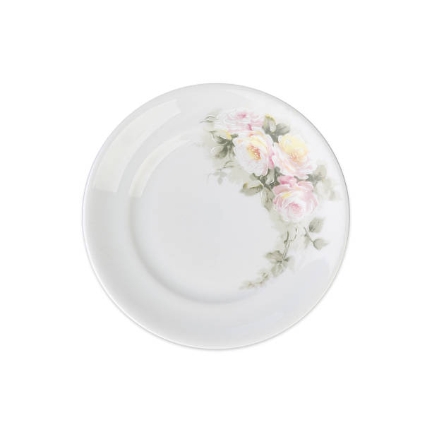 istock Old white decorated ceramic plate with  flowers isolated over white background 2226510496