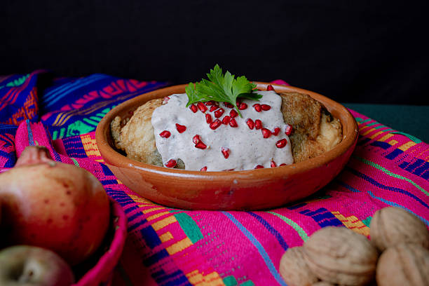 istock Classic Mexican chile en nogada served in a clay dish 2226510918