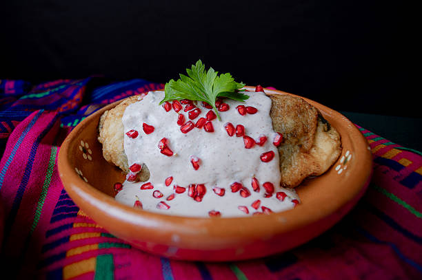 istock Classic Mexican chile en nogada served in a clay dish 2226510919