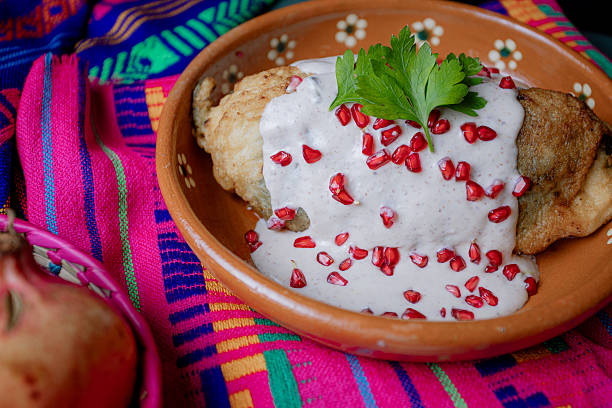 istock Classic Mexican chile en nogada served in a clay dish 2226510994